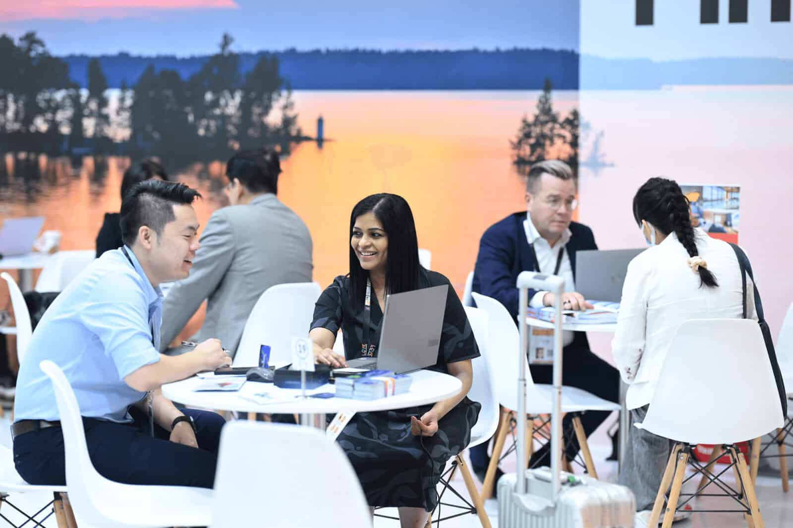 Vibrant networking at ITB Asia 2026 travel trade show in Singapore.