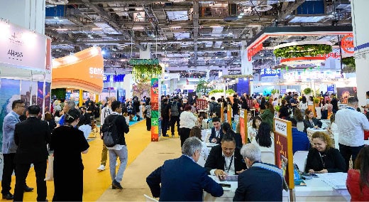 Attendees at ITB Asia 2026 trade show engaging in networking and exploring travel industry innovations in Singapore.
