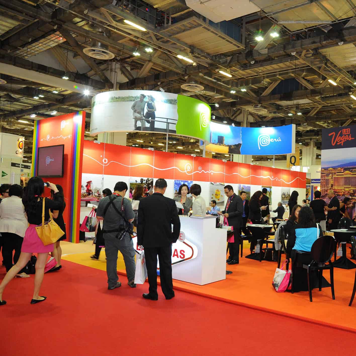 Vibrant travel trade exhibition at ITB Asia 2026 in Singapore with industry professionals networking.