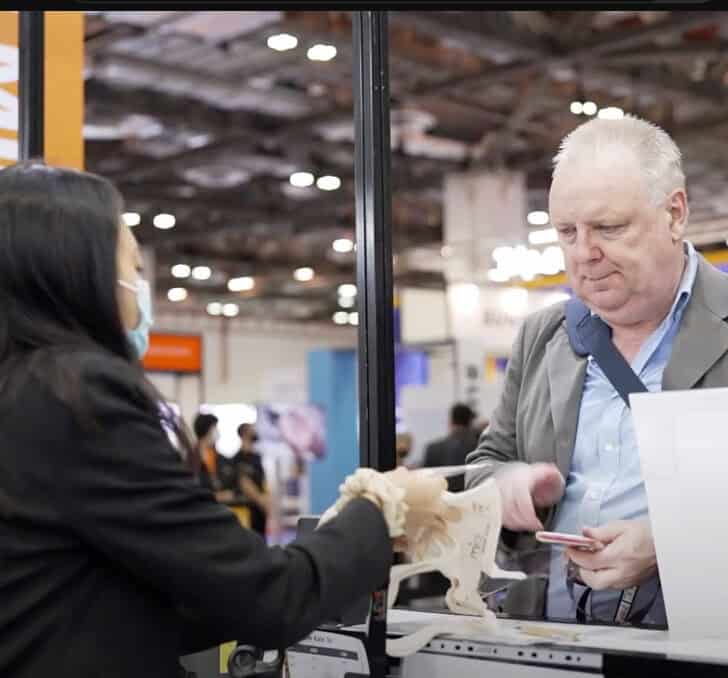 Innovative trade show interaction at ITB Asia 2026, Singapore, with professionals engaging in travel industry networking.