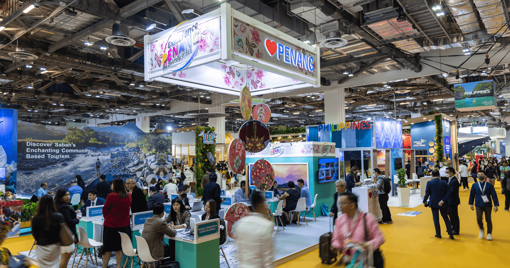 Vibrant scene of international exhibitors and visitors at the Asia's leading travel event in Singapore.