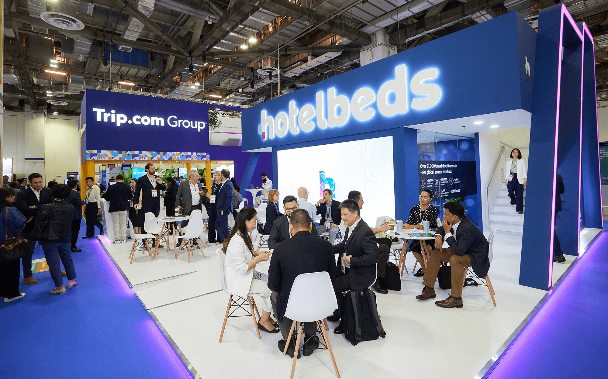 Vibrant exhibition space showcasing hotelbeds and Trip.com Group exhibits at ITB Asia 2026.