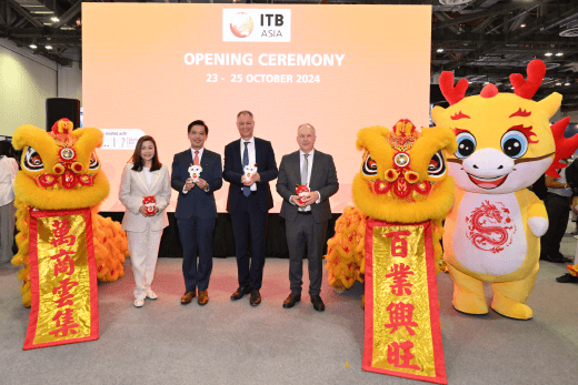 Celebrating the opening of ITB Asia 2024, Singapore's premier travel trade show, with traditional lion dance performances and industry leaders.