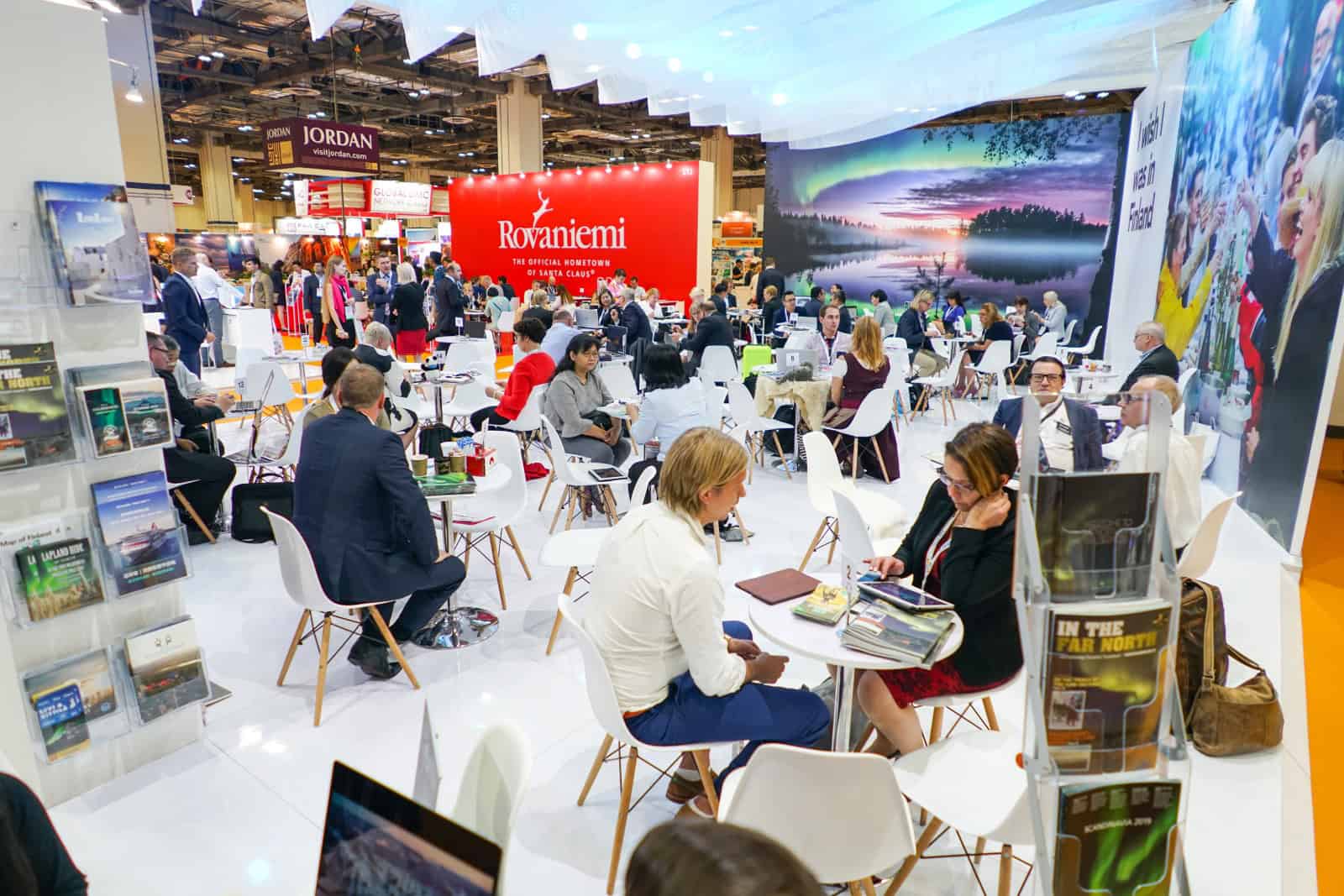 Vibrant trade show floor at ITB Asia 2026 in Singapore with diverse attendees and colorful exhibitor booths.
