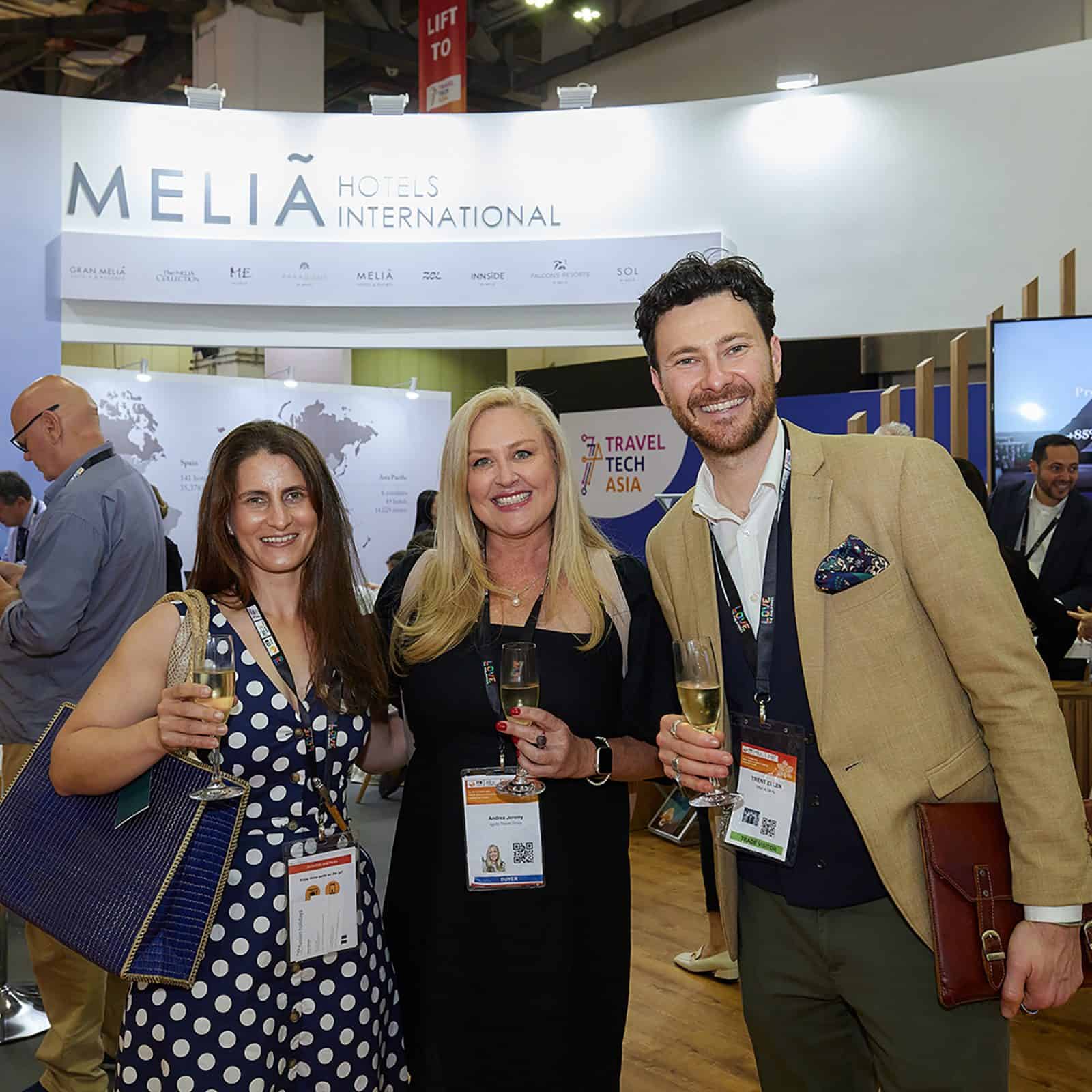 People networking at ITB Asia 2026 travel trade event in Singapore, with bubble displays and branding in background.