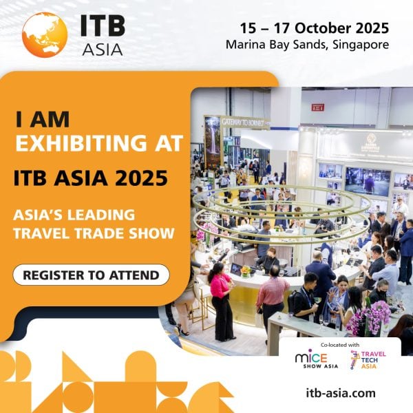 Bright busy exhibition hall at ITB Asia 2025 travel trade show in Singapore.