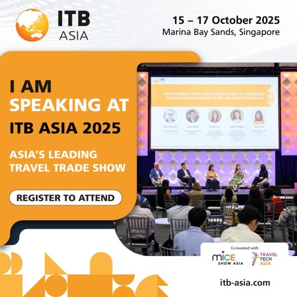Bright conference stage with panel discussion at ITB Asia 2025 travel trade show in Singapore.