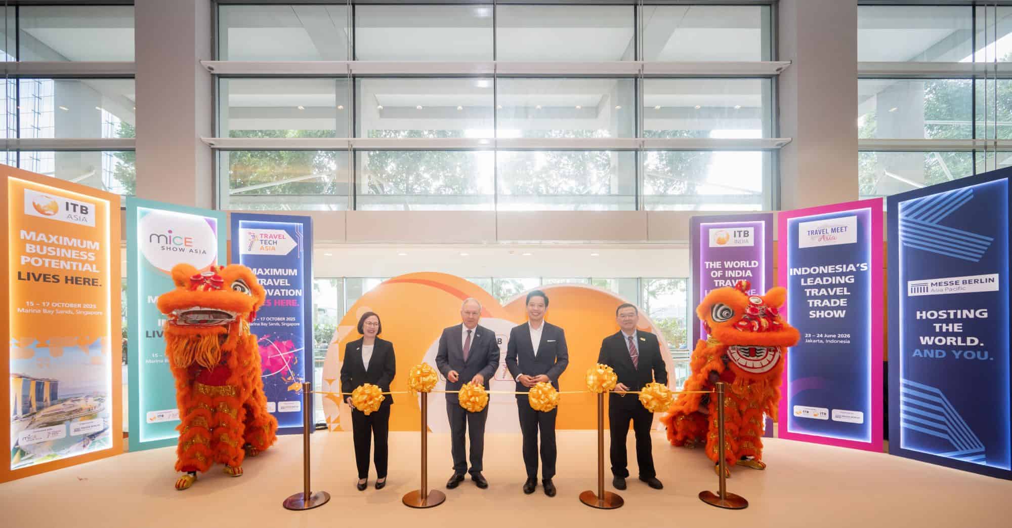 Official opening ceremony of ITB Asia 2026 travel trade show in Singapore with lion dance performers.