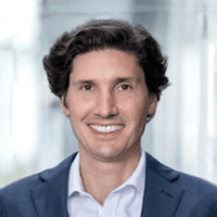 Professional male speaker at ITB Asia 2026 travel trade event in Singapore.