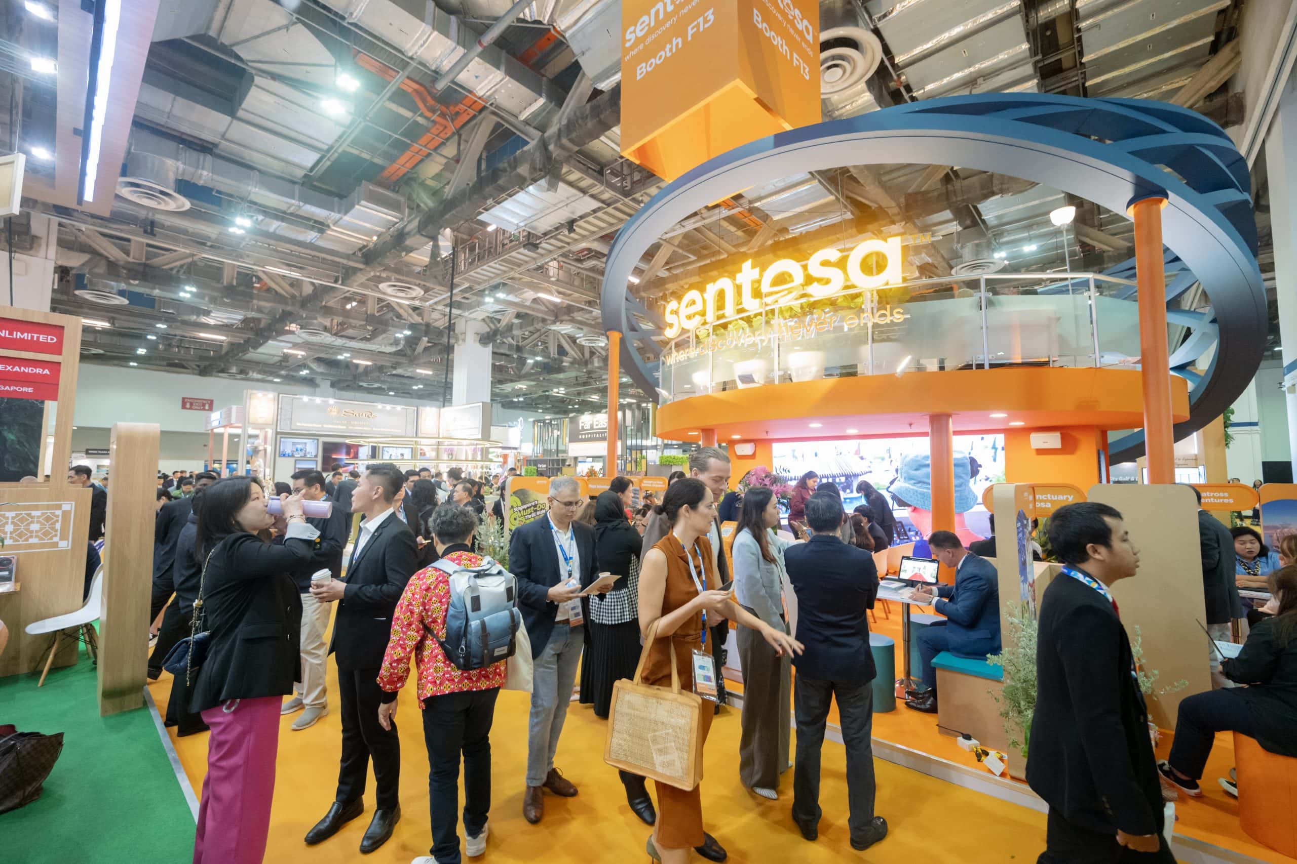 ITB Asia 2026 trade show booth with attendees networking and exploring travel industry innovations.