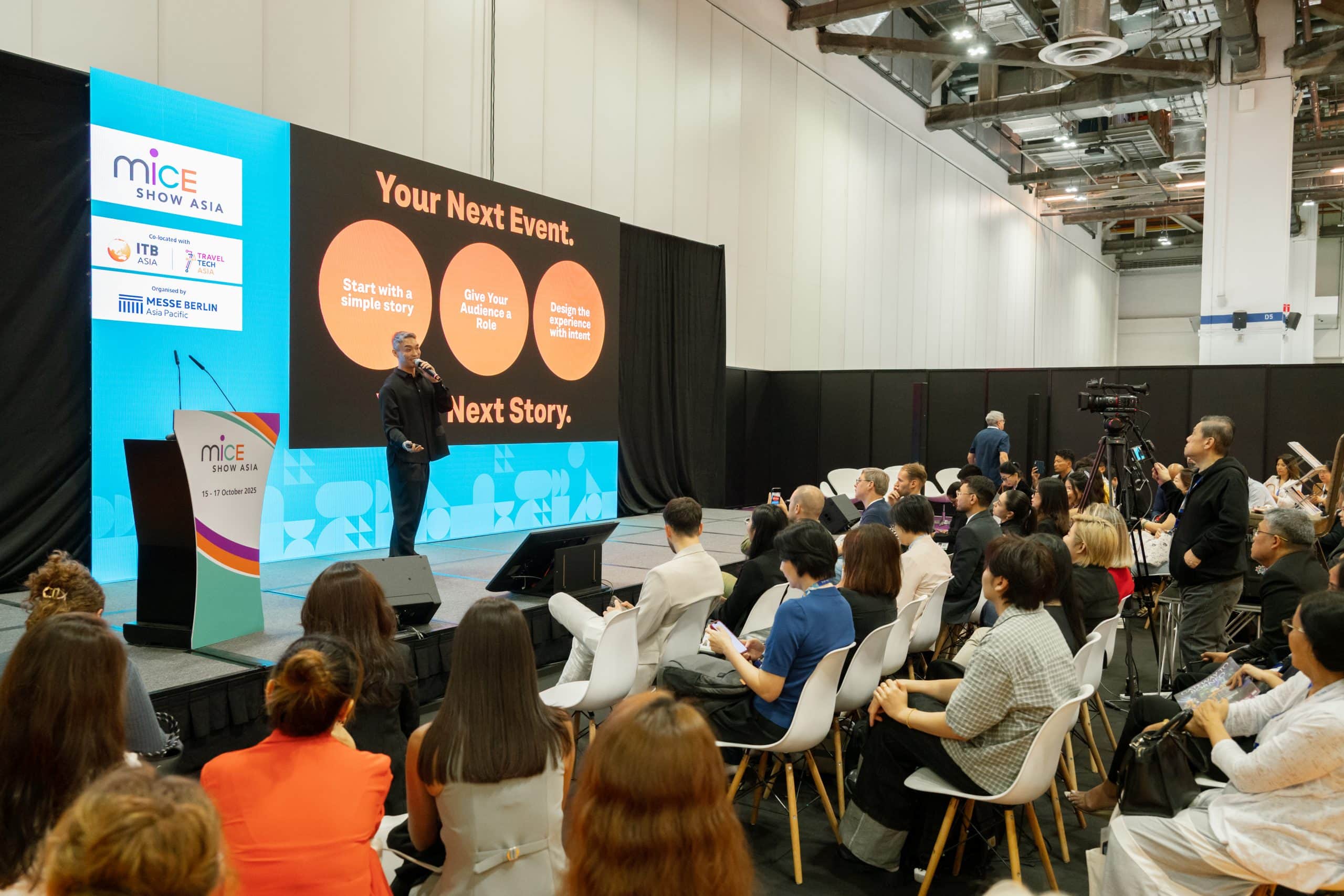 A detailed conference presentation at ITB Asia 2026 with a speaker on stage and an engaged audience.