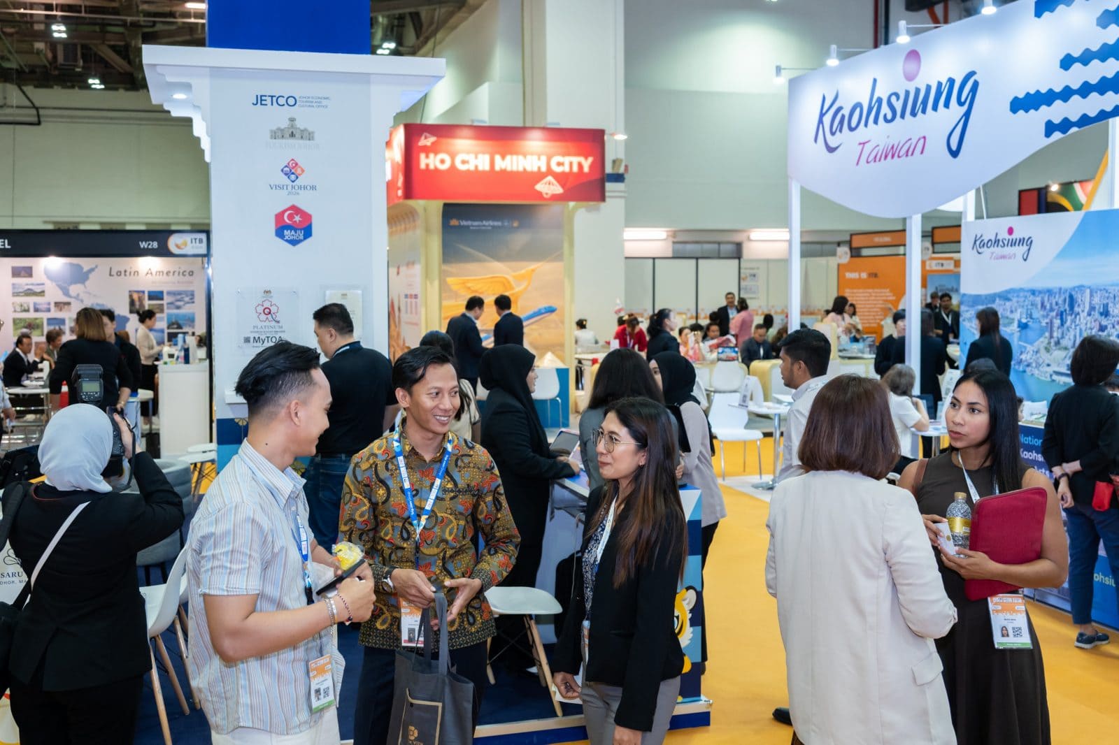 Exhibitors and buyers from across Asia connect face-to-face at ITB Asia 2026, with destination booths from Ho Chi Minh City, Kaohsiung Taiwan, and Johor reflecting the show's diverse regional representation.