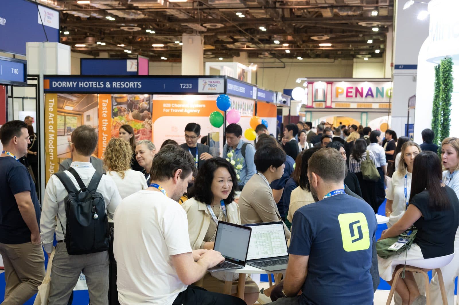 Networking at ITB Asia 2026, Asia's leading travel trade show in Singapore with diverse exhibitors and visitors.