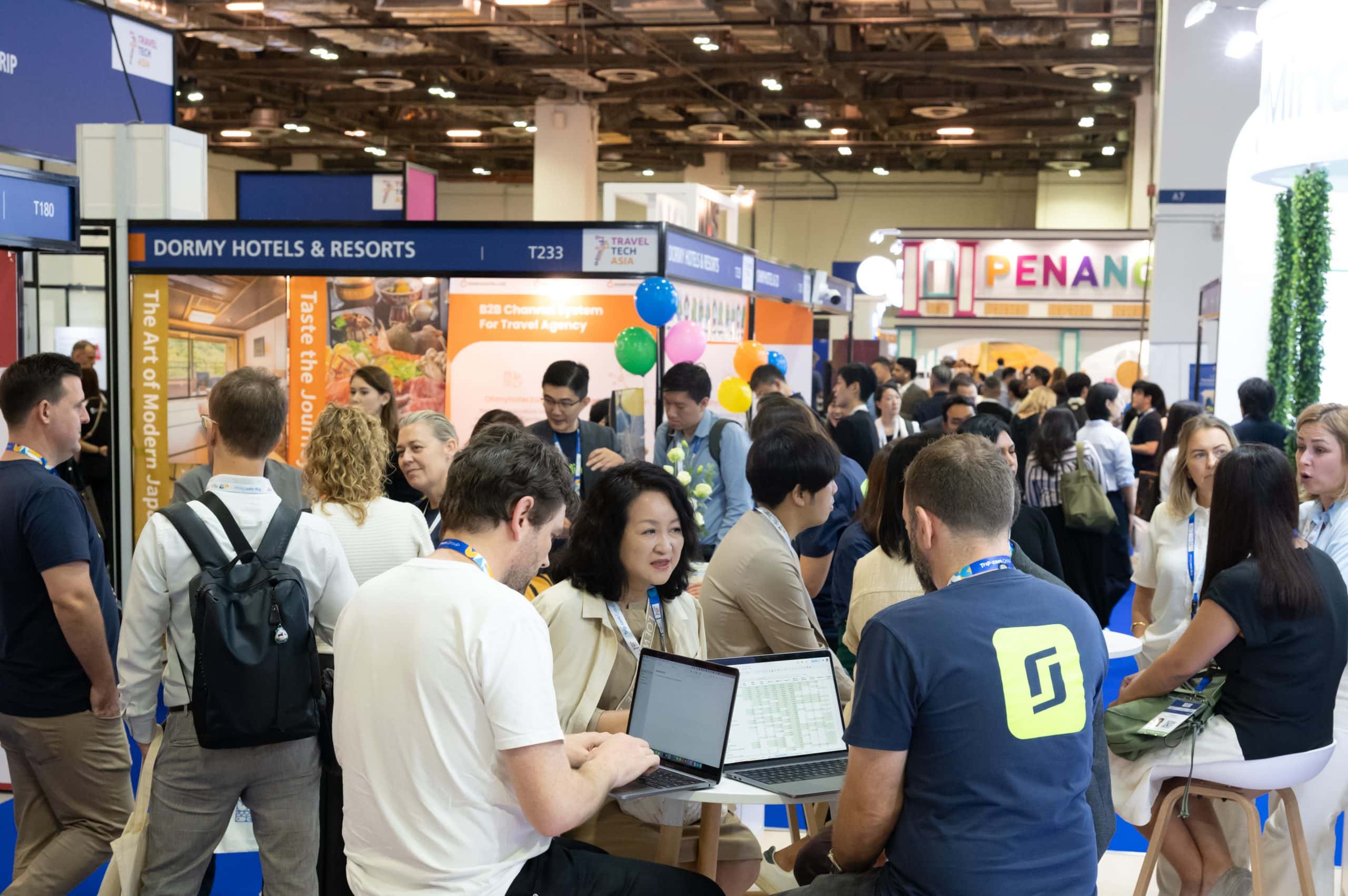 Attendees networking at ITB Asia 2026 travel trade show in Singapore.
