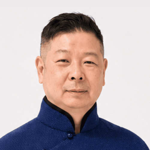 Professional Asian man in traditional attire at ITB Asia 2026 event.