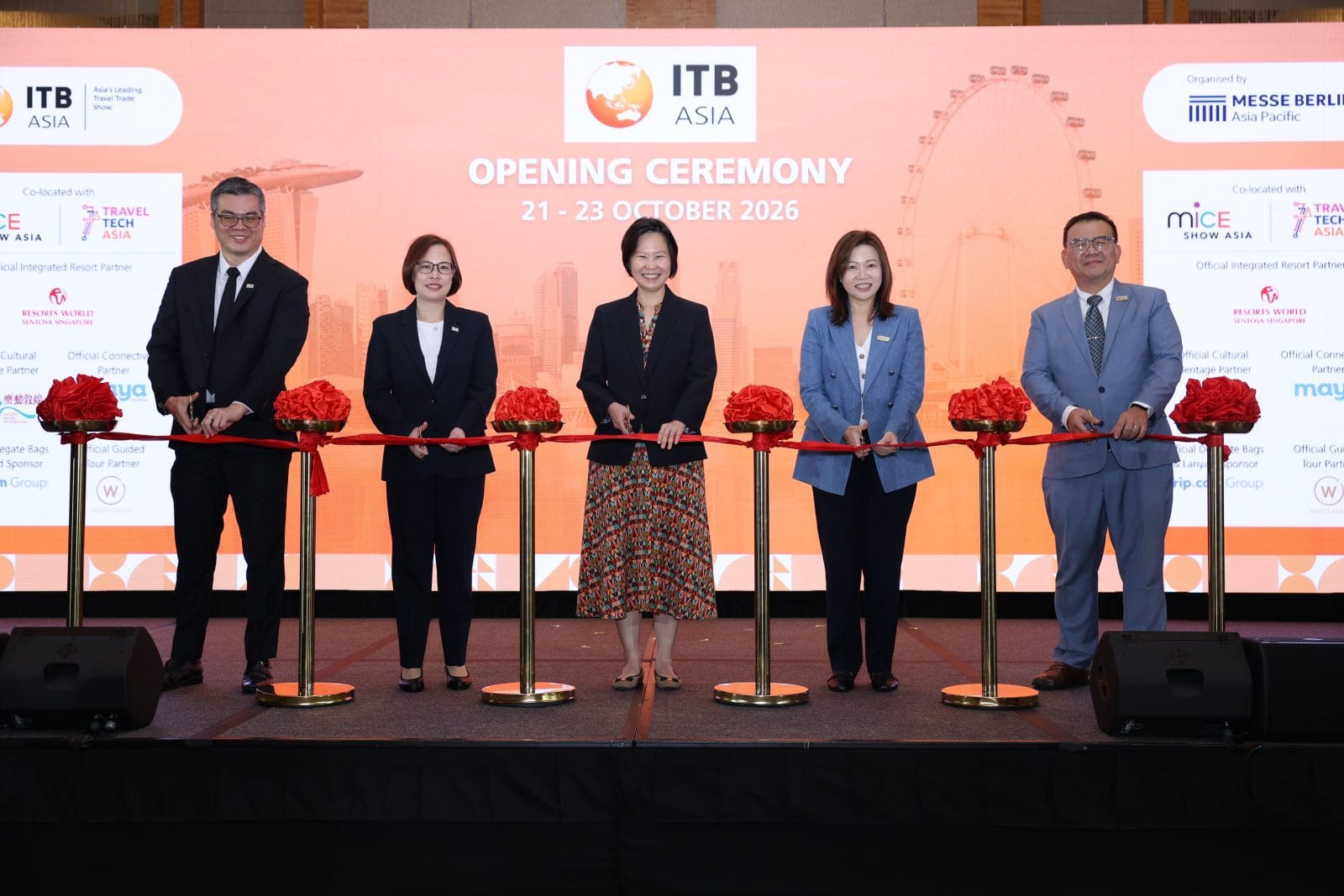 Executives at the ITB Asia 2026 opening ceremony in Singapore, celebrating the travel trade show's launch.