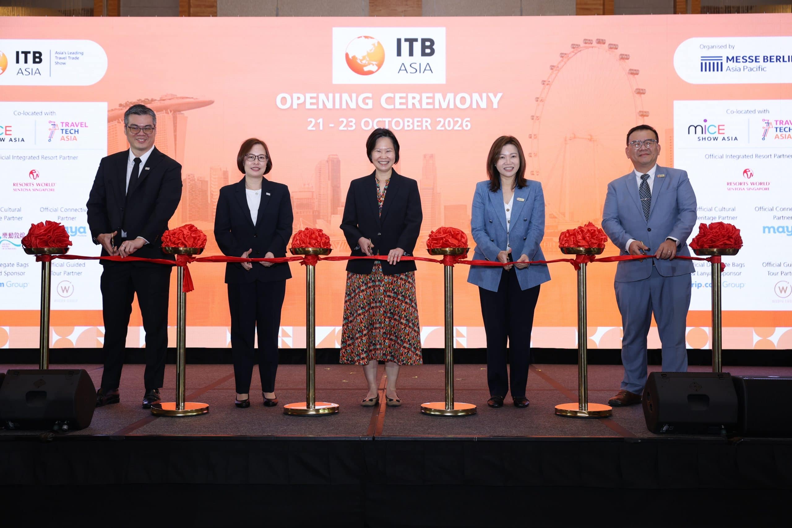 Group of five professionals at ITB Asia 2026 opening event in Singapore.