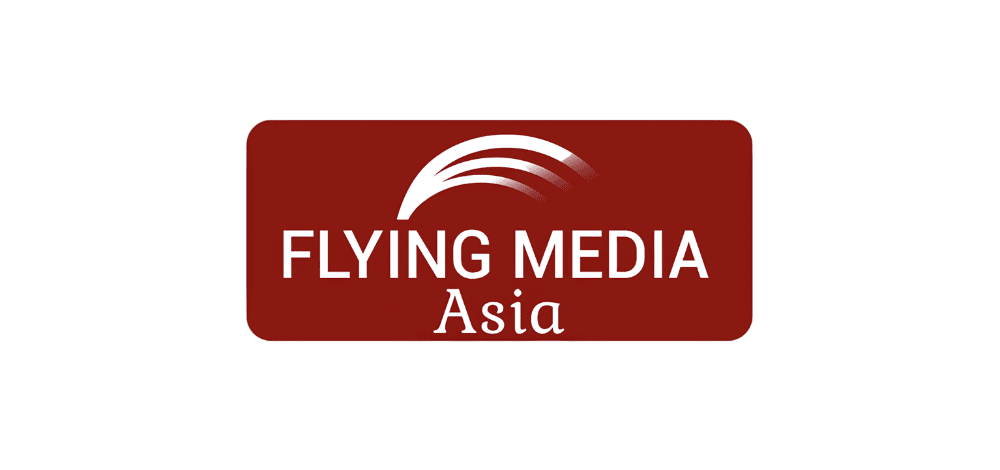 Flying Media Asia logo at ITB Asia 2026 travel trade show in Singapore.