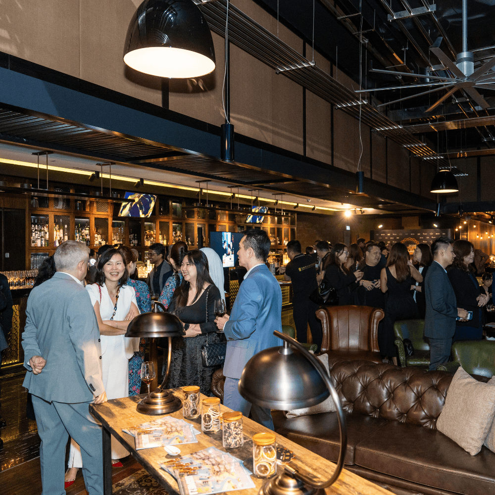 Networking at ITB Asia 2026 travel trade show in Singapore.