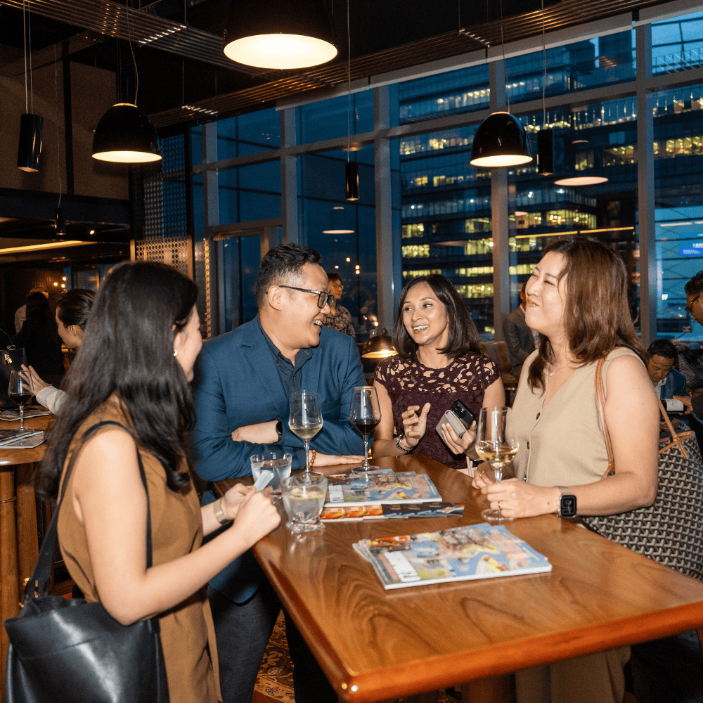 Business professionals networking at ITB Asia 2026 in Singapore.