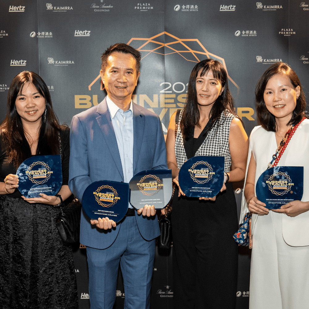 Group of four people holding awards at ITB Asia 2026 in Singapore.