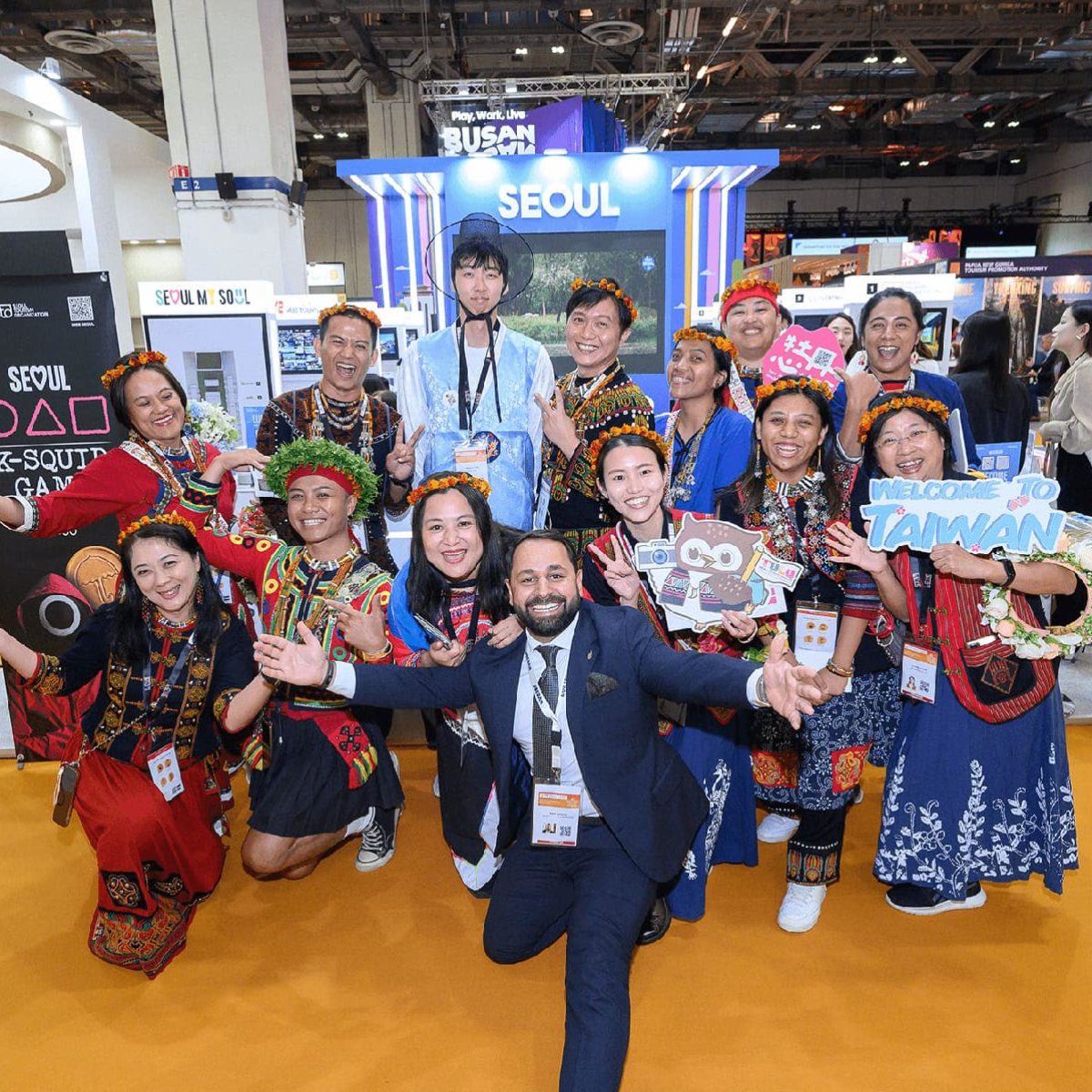Colorful group at ITB Asia 2026 travel trade show in Singapore, showcasing Asian cultural diversity.